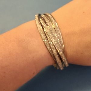 Layered sparkly silver bracelets